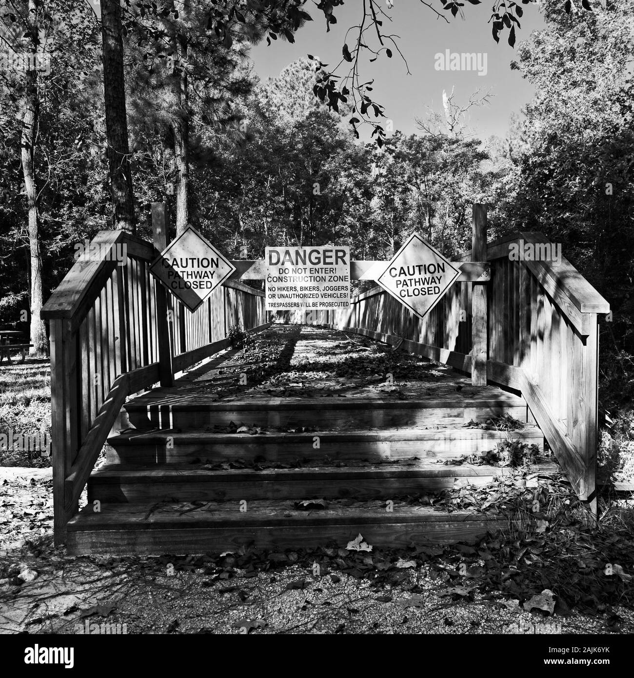 Spring TX USA - 10/10/2019  -  Wooden Bridge Closed Danger Sign in B&W Stock Photo
