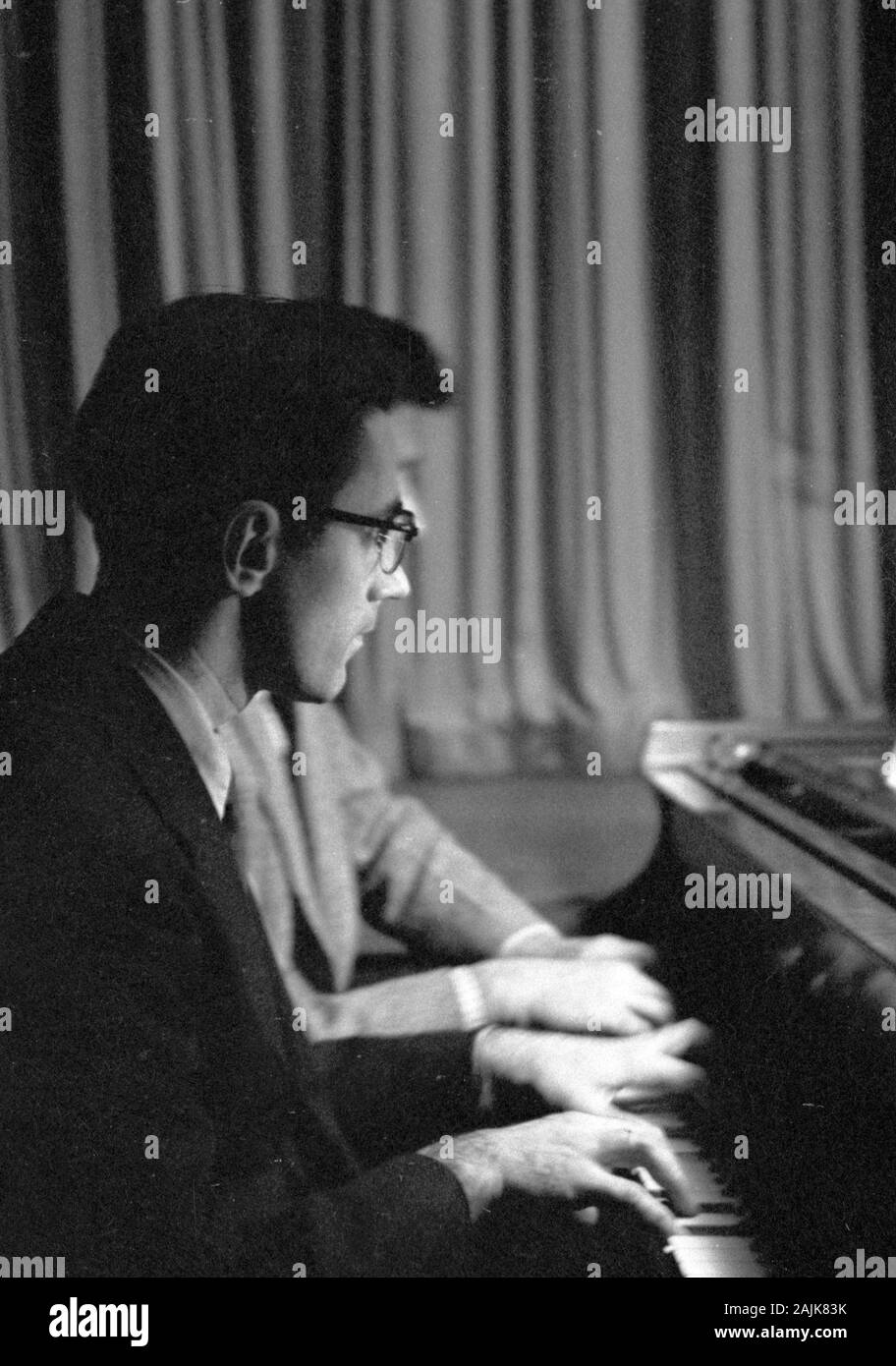 John Cage and David Tudor in performance in New York City, 1957, probably performing Winter Music. The exact date and venue are unknown. Stock Photo