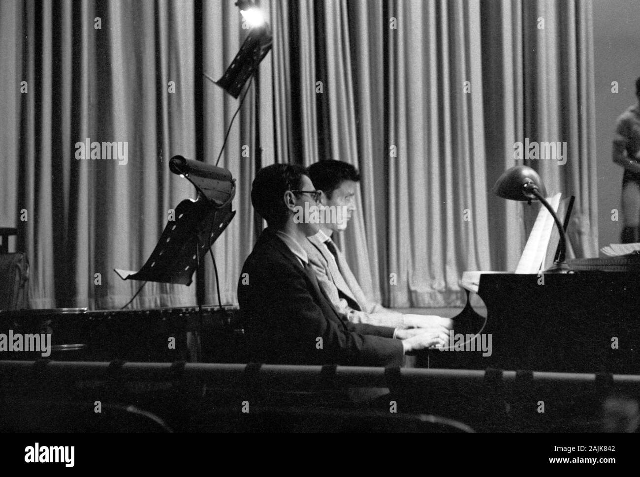 John Cage and David Tudor in performance in New York City, 1957, probably performing Winter Music. The exact date and venue are unknown. Stock Photo