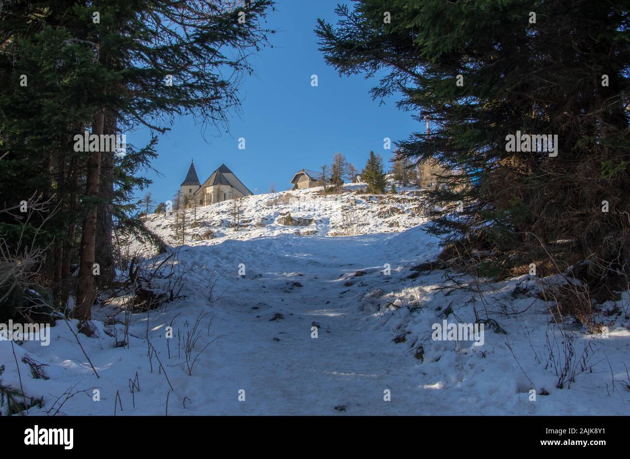 Uršlja gora, Slovenia - January 2, 2020;  Peak Uršlja gora in Slovenia with church St. Uršula. A lonely peak in the heart of Koroška region. Stock Photo