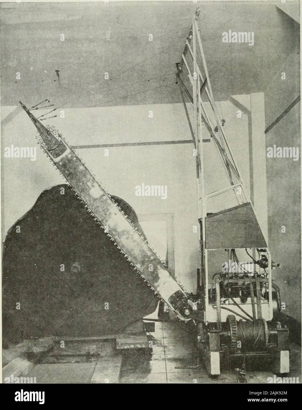 Logging; the principles and general methods of operation in the United States . m dagos havebeen used successfully for bucking-up logs. The equipment consists of a traction engine with an aircompressor and an air storage tank. The saws which may beattached readily to a log of any size are of the drag-saw type,driven by a piston working from a small cylinder, mounted ona metal frame weighing from 60 to 75 pounds. The cylinder isconnected with the air chamber on the engine by a line of hoseof sufficient length to give a working radius of 300 feet. Threeframes and one saw are the usual equipment Stock Photo