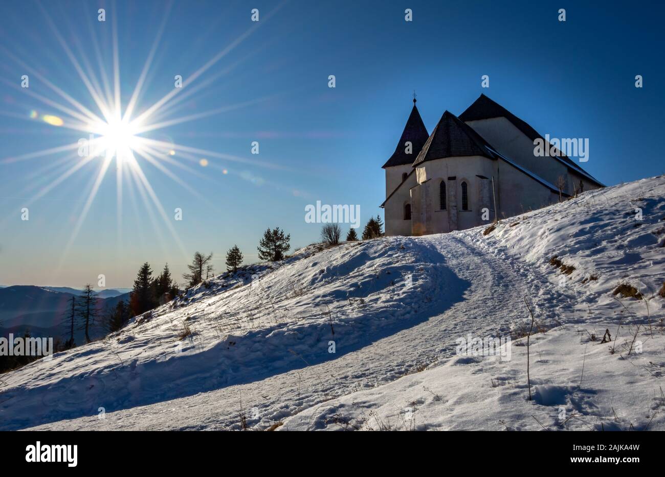 Uršlja gora, Slovenia - January 2, 2020;  Peak Uršlja gora in Slovenia with church St. Uršula. A lonely peak in the heart of Koroška region. Stock Photo