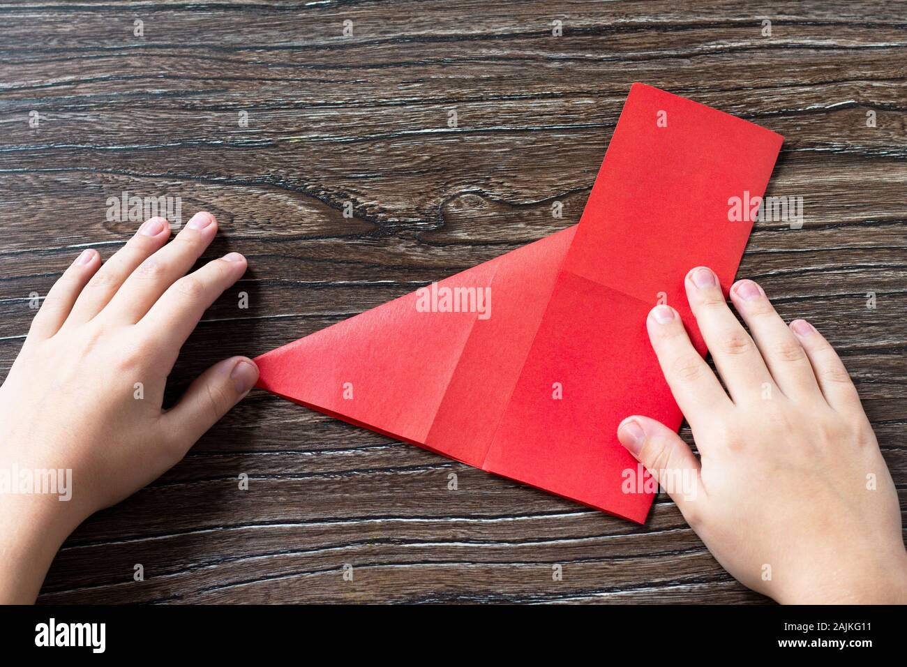 Step 4 origami. Greeting card with valentine heart congratulation.  Children's art project craft for kids. Craft for children Stock Photo -  Alamy