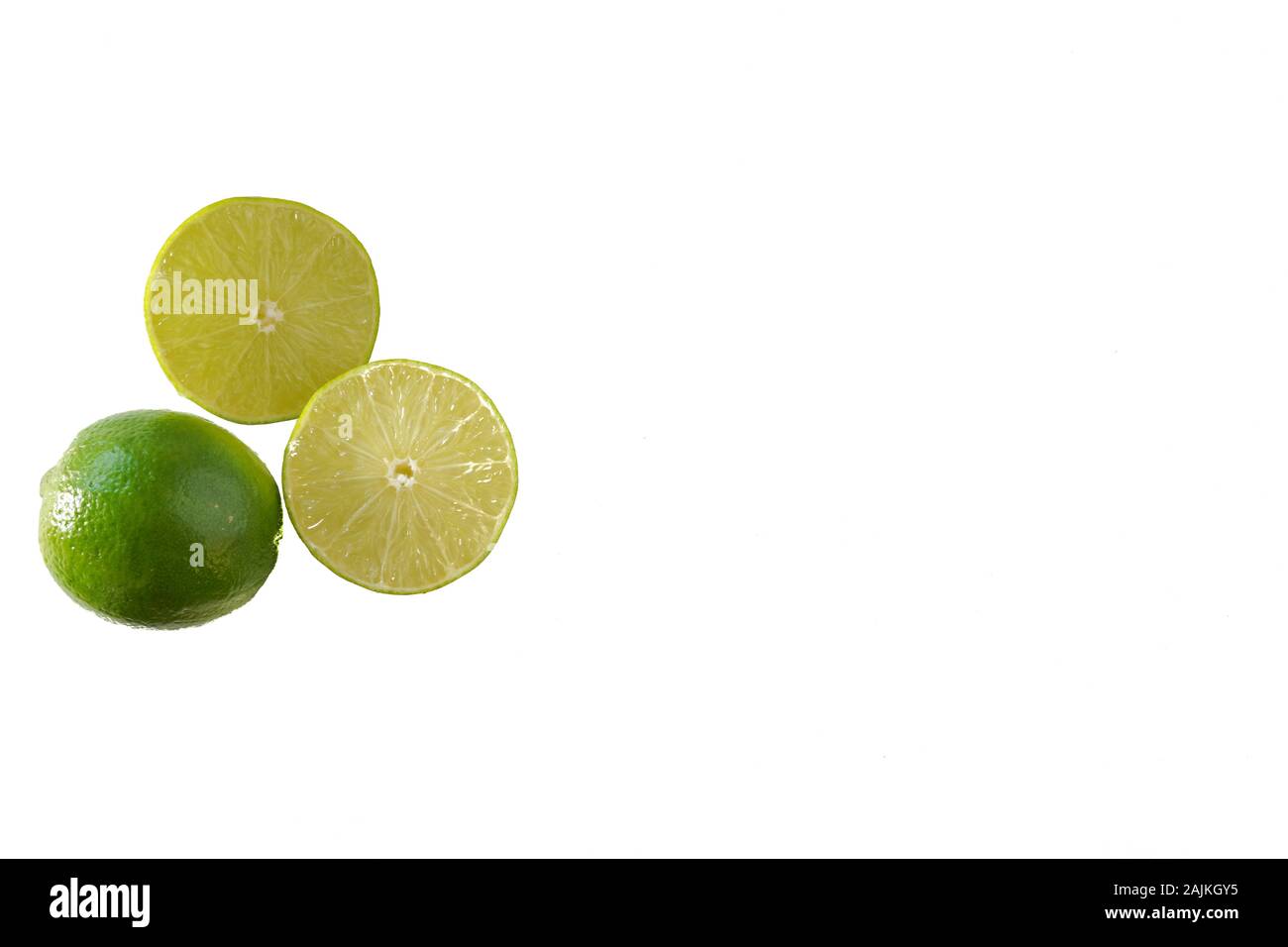 Green limes isolated on white; fruit and food preparation Stock Photo