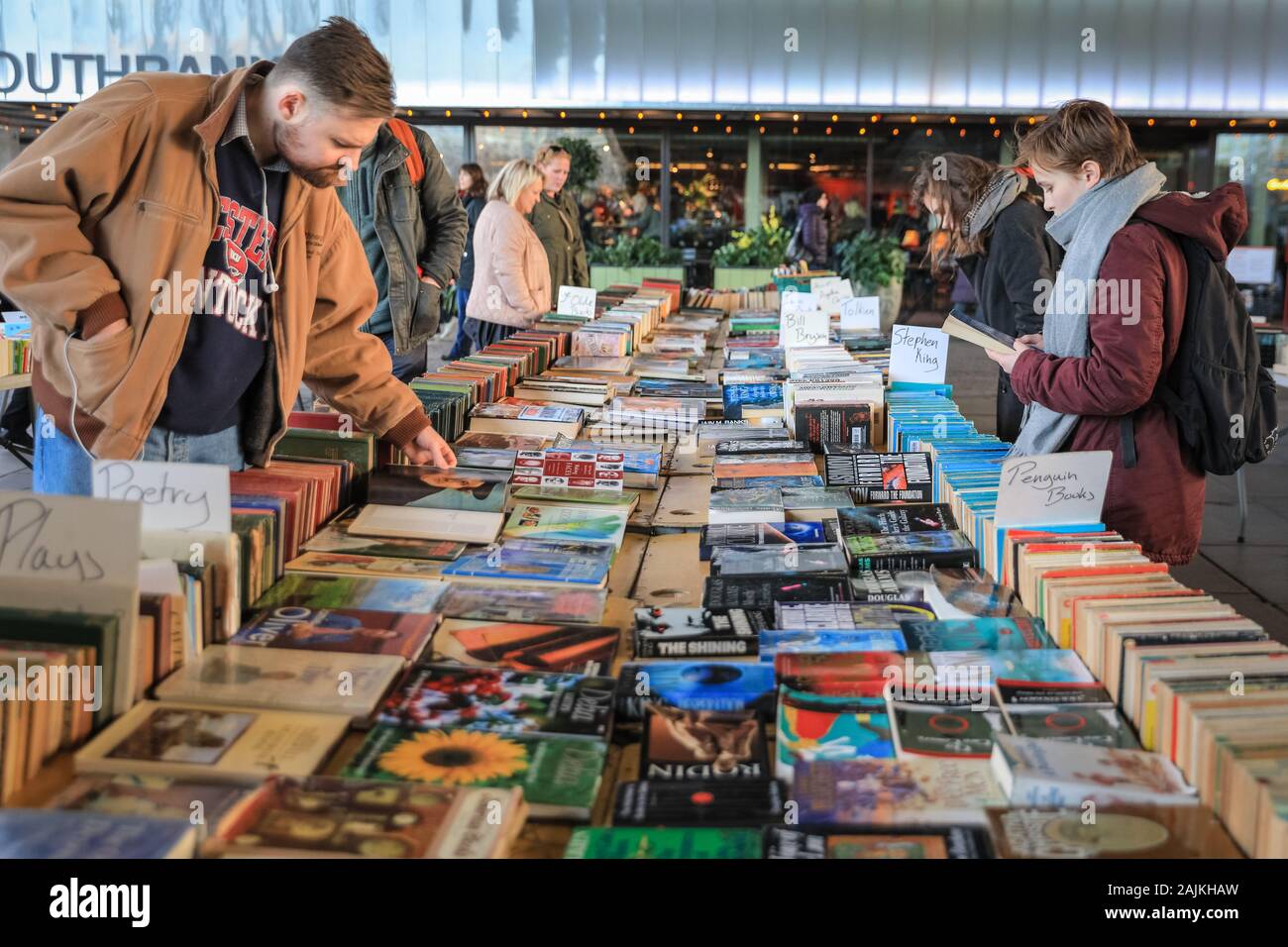 People browse at the Southbank Centre outdoor weekend book market, South Bank, London, UK Stock Photo