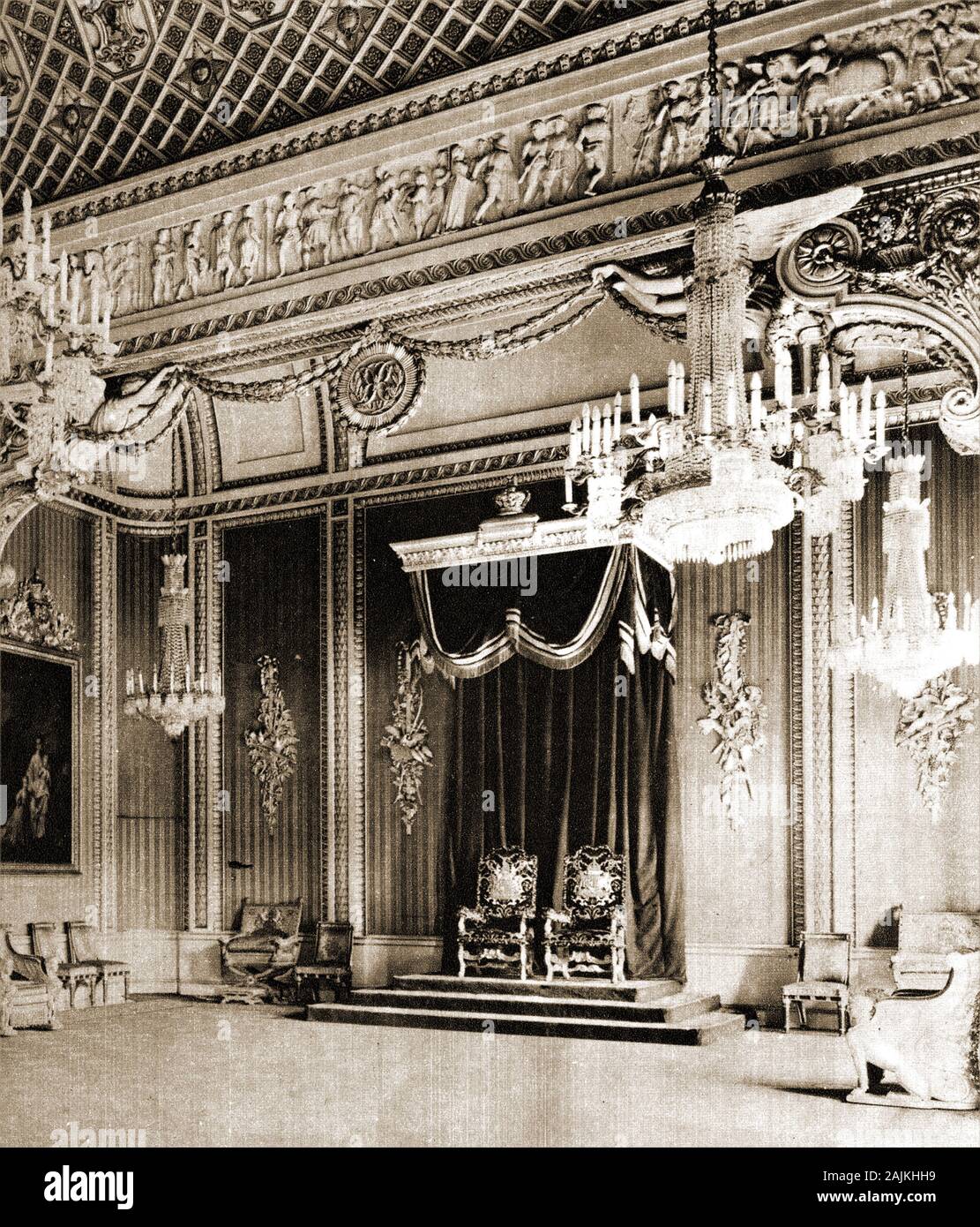 1920. The  royal throne room at Buckingham Palace, London, UK,  after being made ready for debutantes  (young upper class women) to be presented the King & Queen. The last debutantes were presented in this way in  1958, after which Queen Elizabeth II abolished the ceremony. Queen Charlotte's Ball, a contemporary revival of the tradition is still organised annually by the Duke of Somerset. Stock Photo