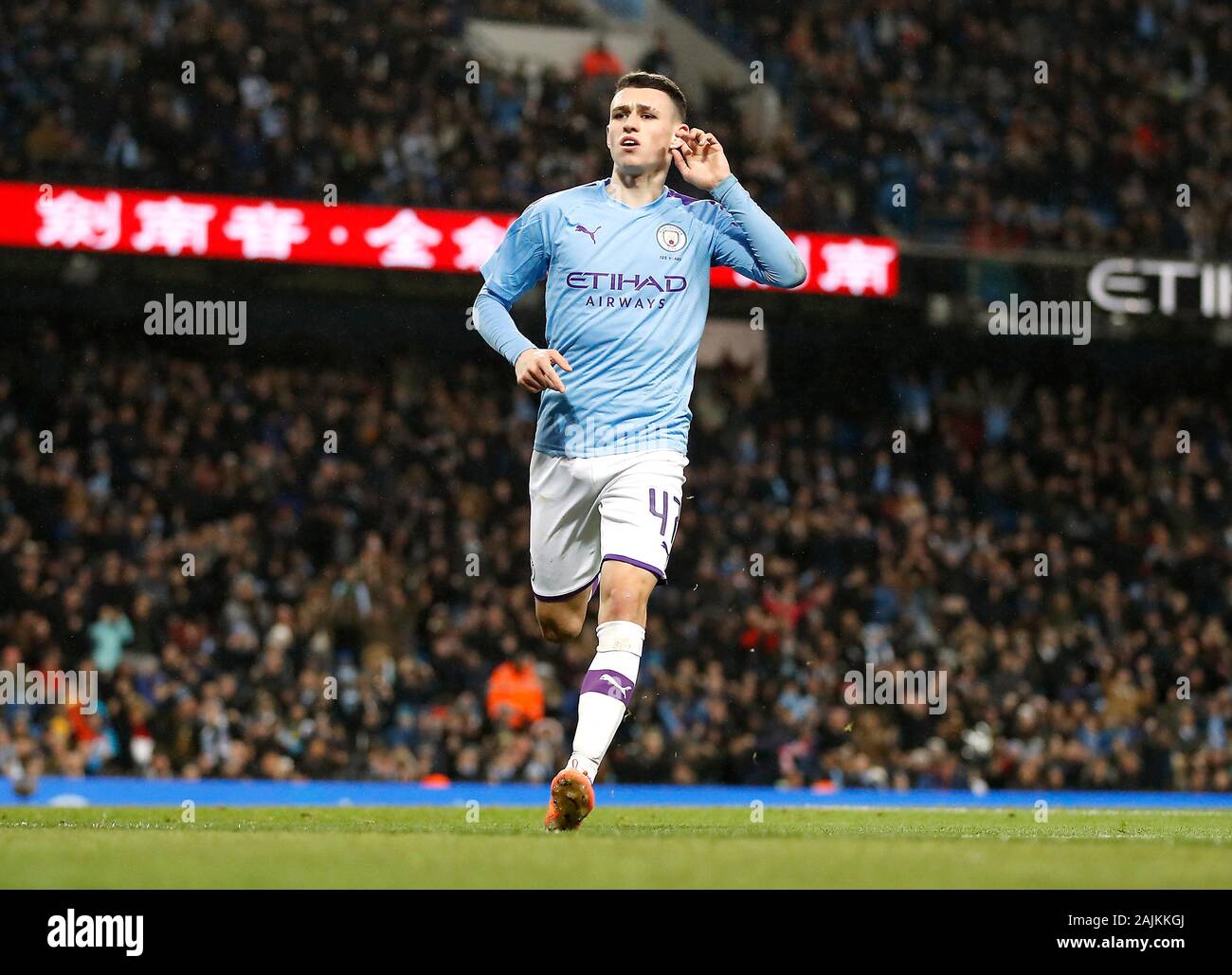 Manchester City's Phil Foden celebrates scoring his side's fourth goal of the game during the FA Cup third round match at the Etihad Stadium, Manchester. Stock Photo