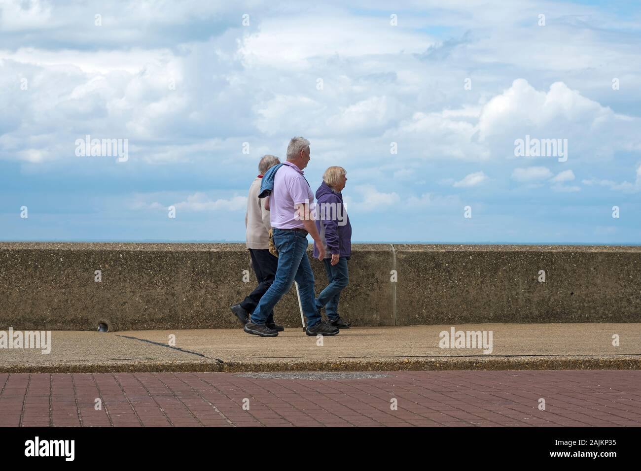 British family walking along a seafront Stock Photo