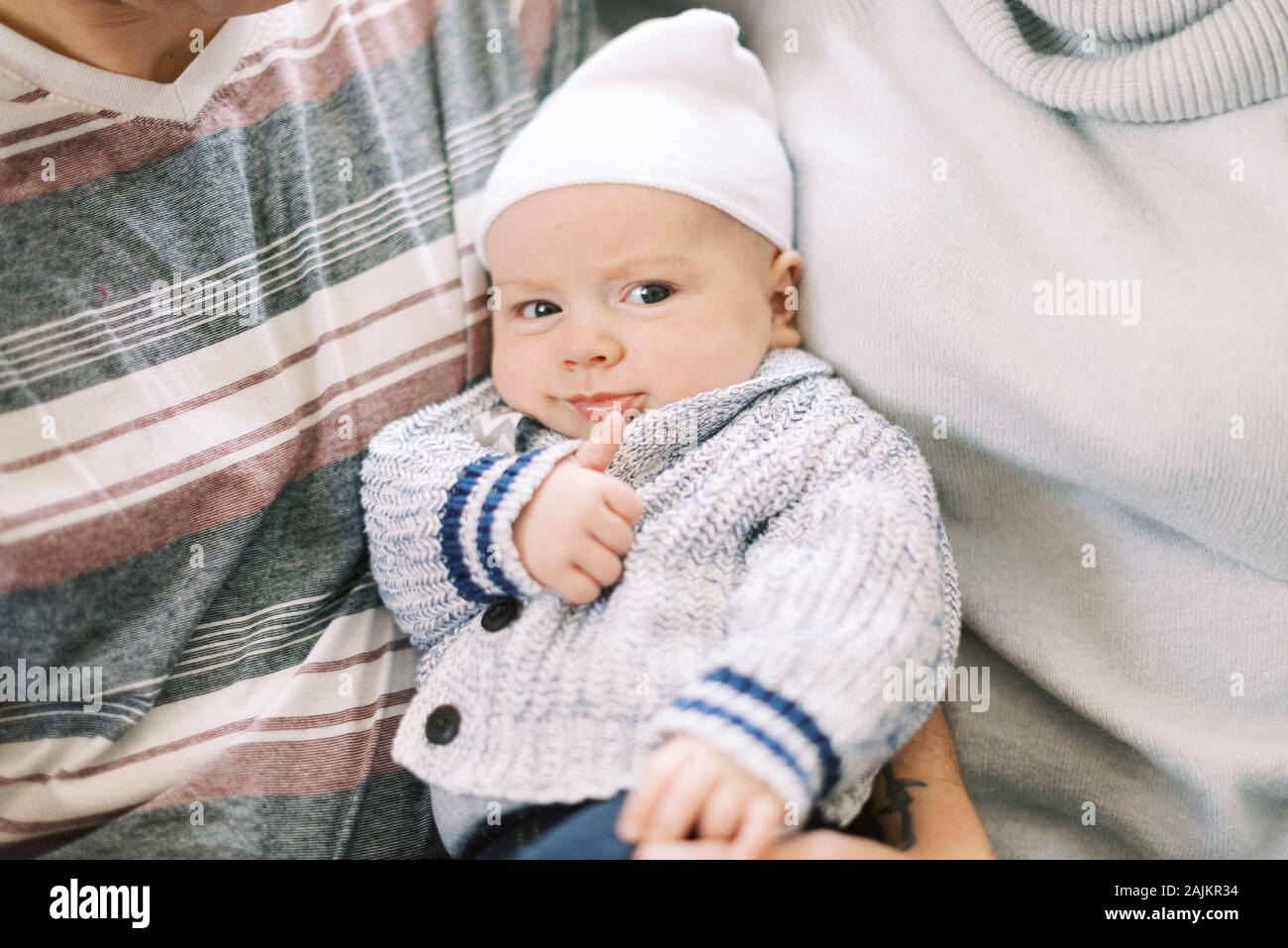 Three month old giving a thumbs up for a job well done. Stock Photo