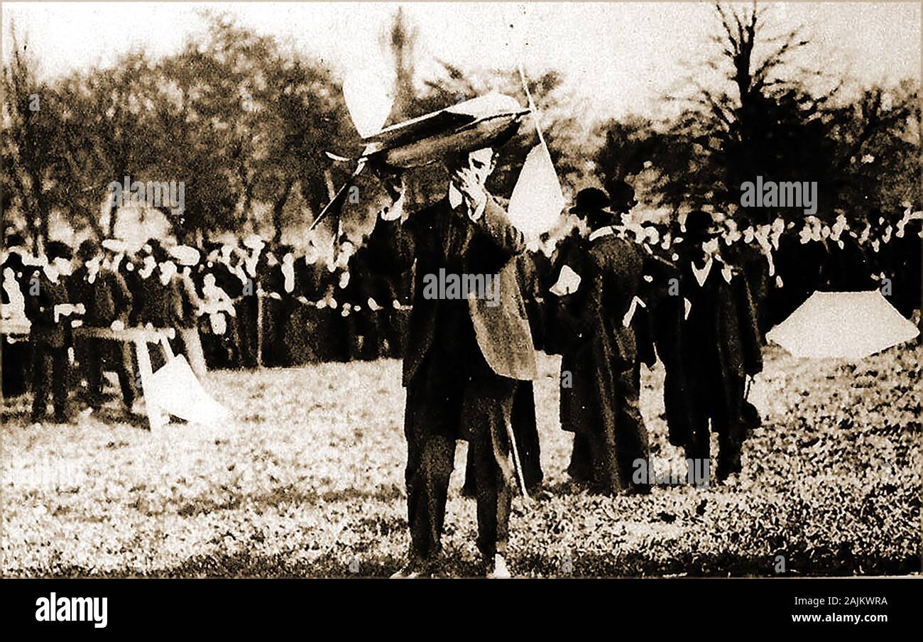 1907 aircraft  design pioneer W. Cochran shows one of his first models at the Alexandra Palace / Park Aero Club Trials, UK. They were organised by the Daily Mail newspaper. Only a year before the club had organised the first official balloon race. Stock Photo