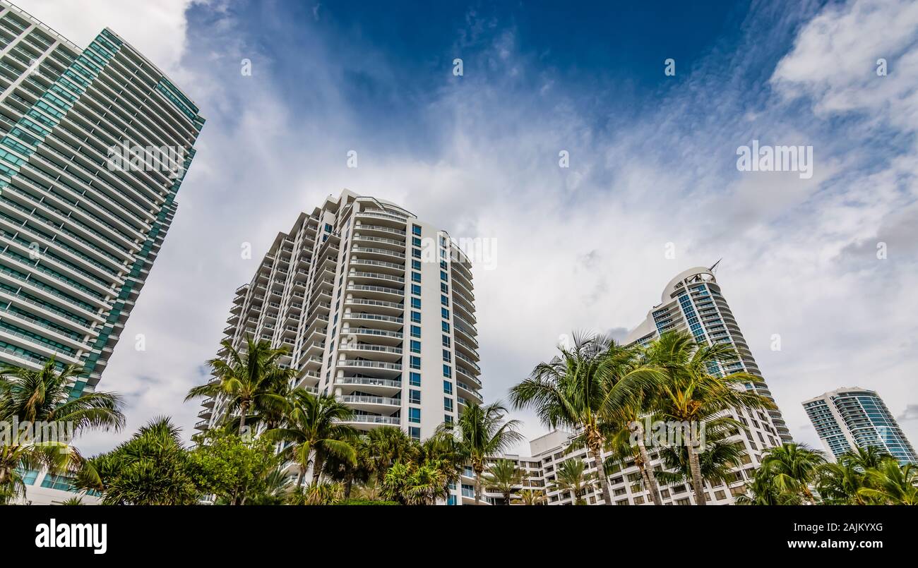 Bottom view of high rise buildings and modern skyscrapers at the coastline of Hollywood beach. Broward County real estate concept. Stock Photo