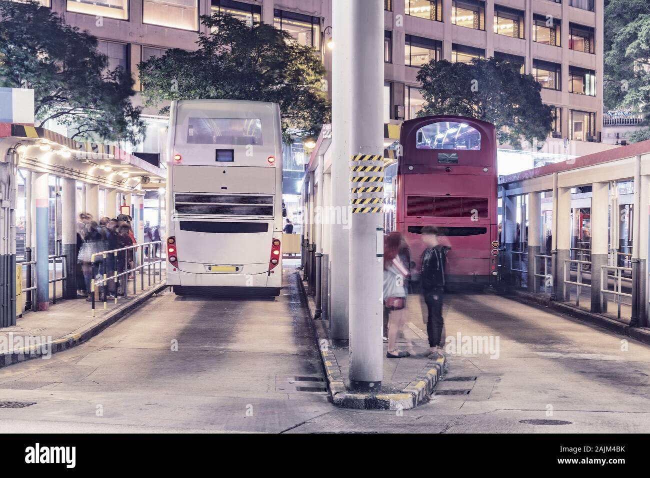 Buses stand by the platforms before departure. Kowloon. Stock Photo