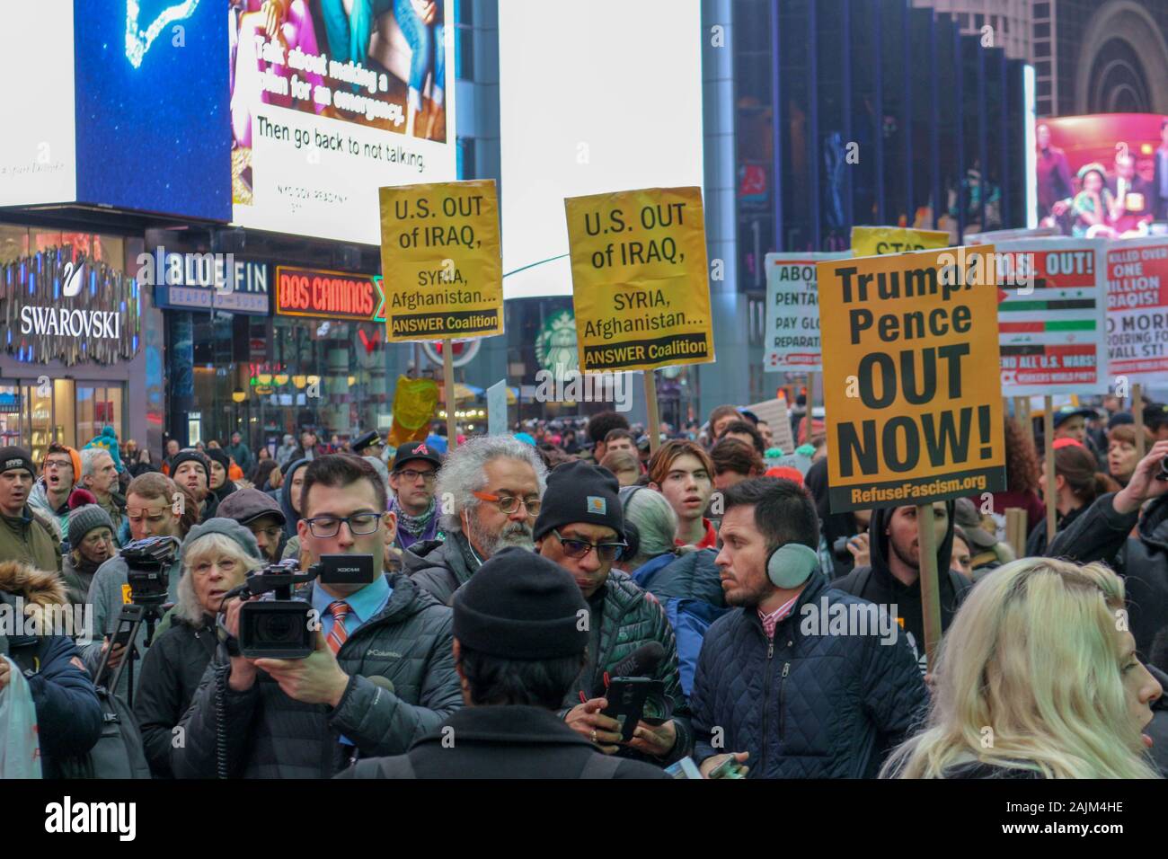 New York, NY – January 04, 2020: Hundreds of people gathered in Times Square in New York City to protest war against Iran & Iraq on January 4th 2020. Stock Photo
