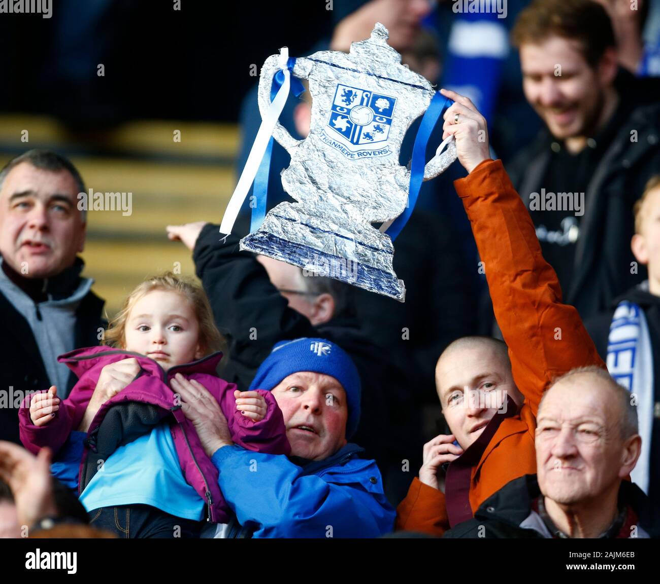WATFORD, ENGLAND - JANUARY 04:   Tranmere Rovers Fan holding FA Cup during Emirates FA Cup Third Round match between Watford and Tranmere Rovers on Ja Stock Photo