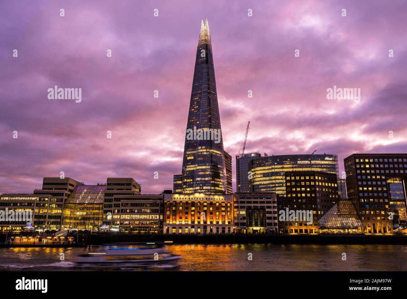 The Shard,or The Shard of Glass, at sunset, twilight, golden hour is a 95-storey supertall London skyline skyscraper, Southwark, London England UK Stock Photo