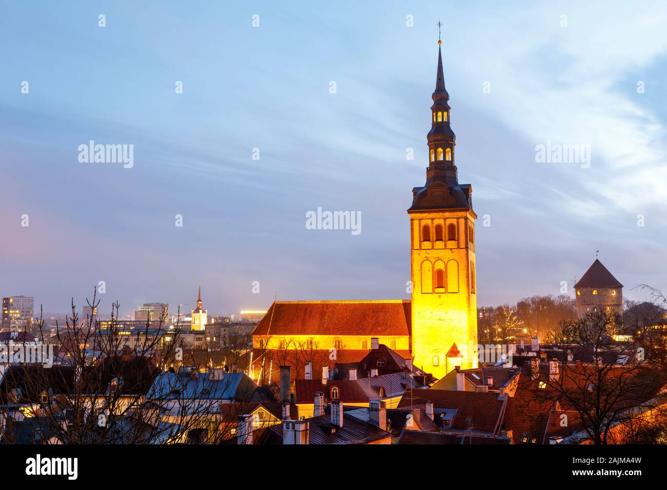 Illuminated tower of church st. Nicholas in Tallinn, Estonia Stock Photo