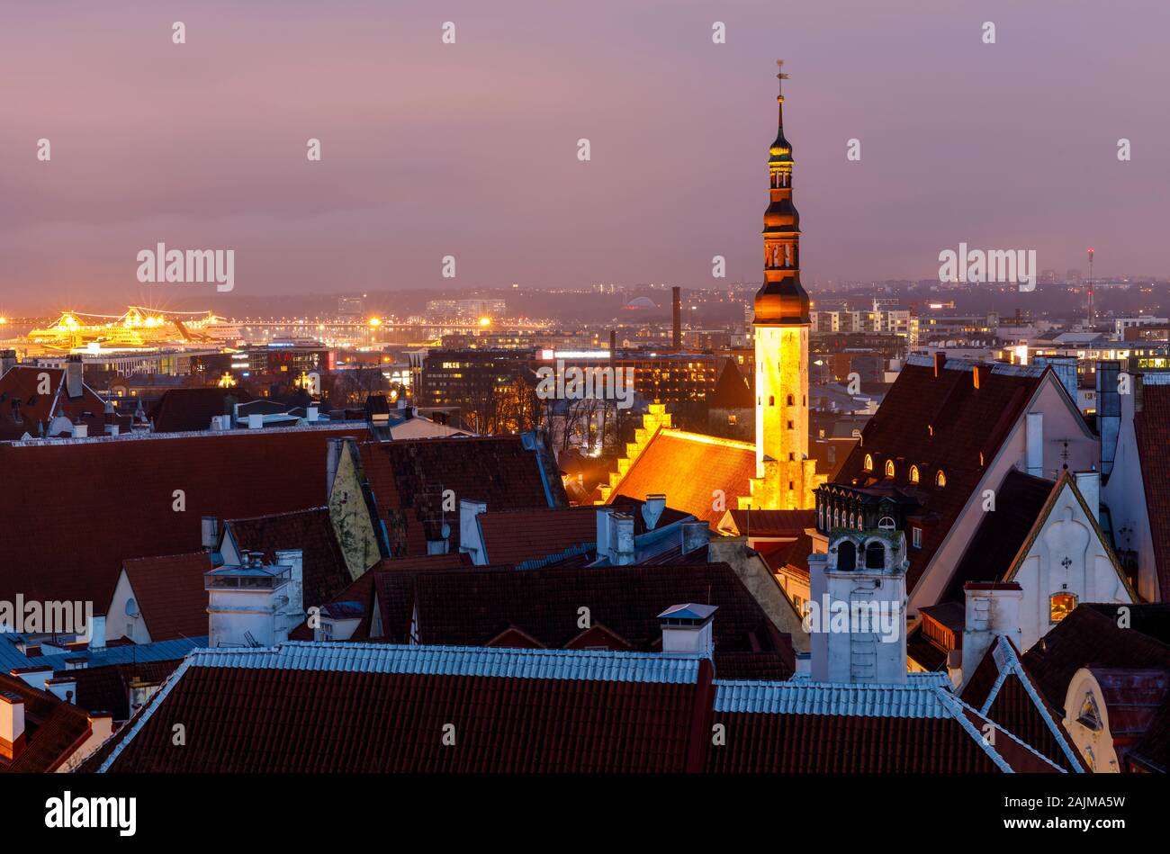 Illuminated tower of holy spirit church at night in Tallinn, Estonia Stock Photo