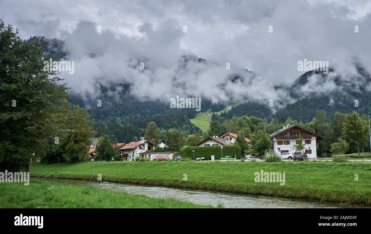 Amer River runs through Bavarian countryside with typical houses and ...