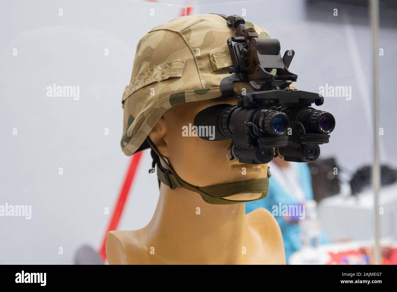 Helmet with night vision device on the demonstration mannequin. Weaponry Stock Photo