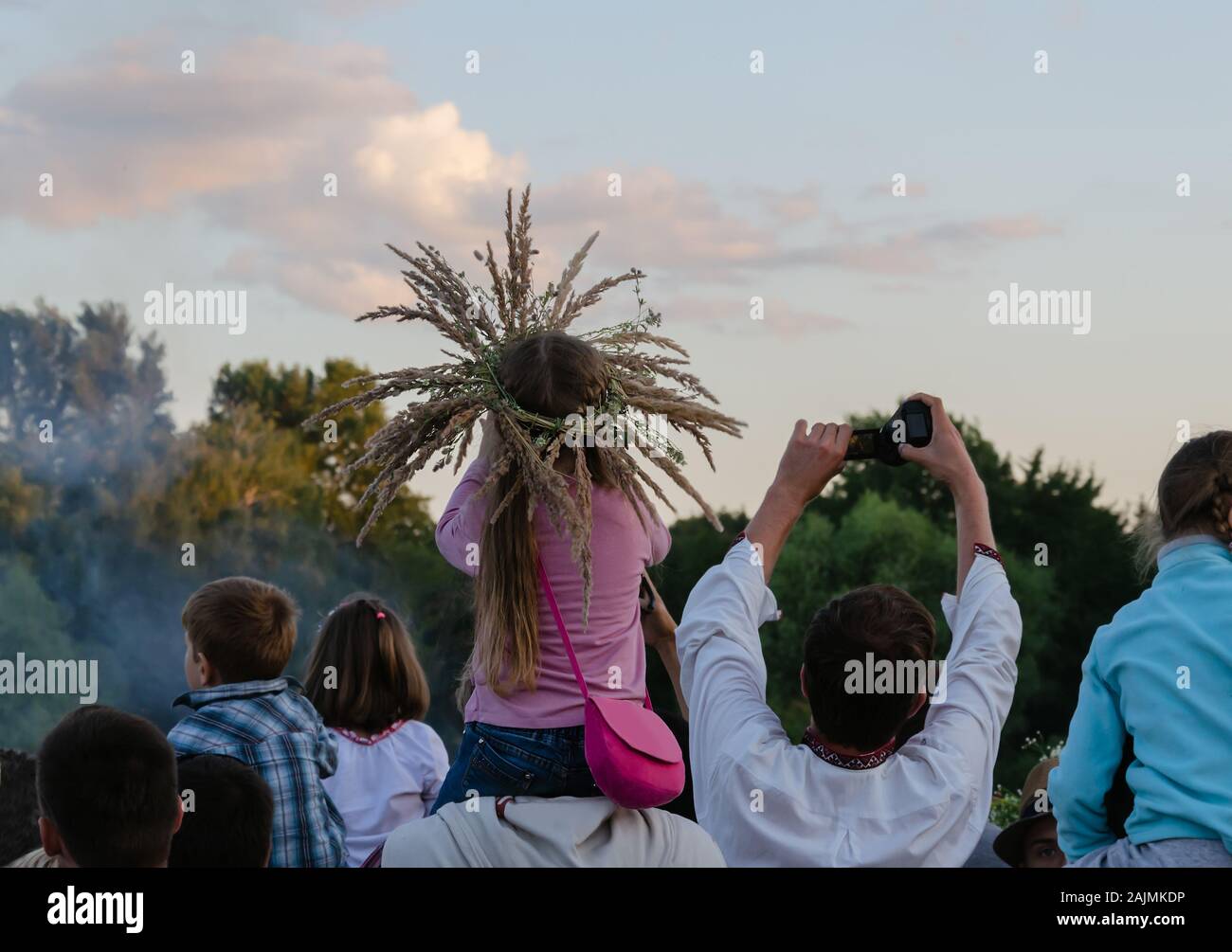 girl in a wreath of field herbs for the holiday of Ivan Kupala, summer day, Ukraine Stock Photo