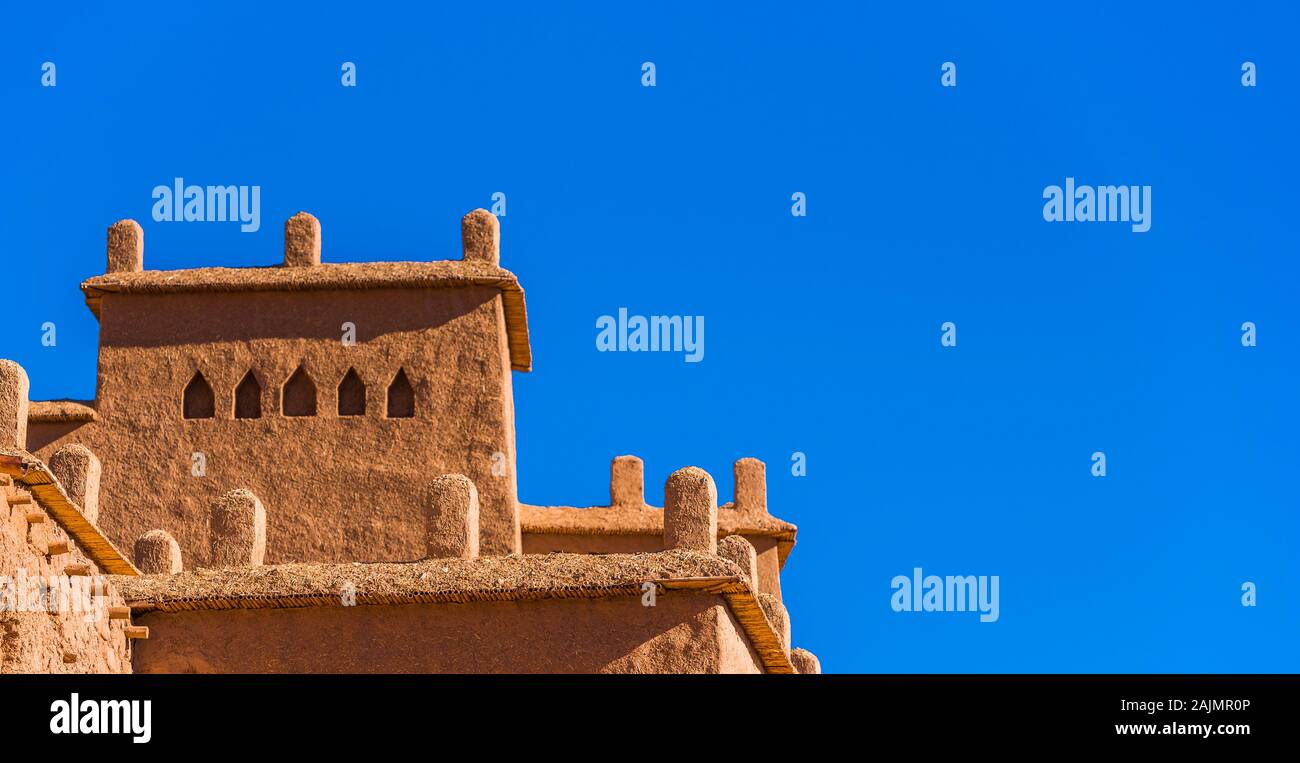 View of the facade of a building in Ait-Ben-Haddou, Morocco. Isolated on blue background Stock Photo