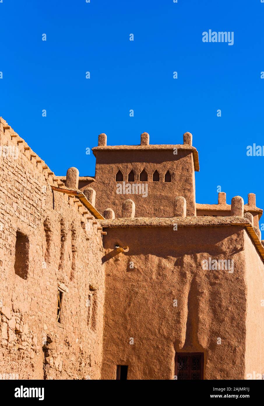 View of the facade of a building in Ait-Ben-Haddou, Morocco. Vertical. Isolated on blue background Stock Photo