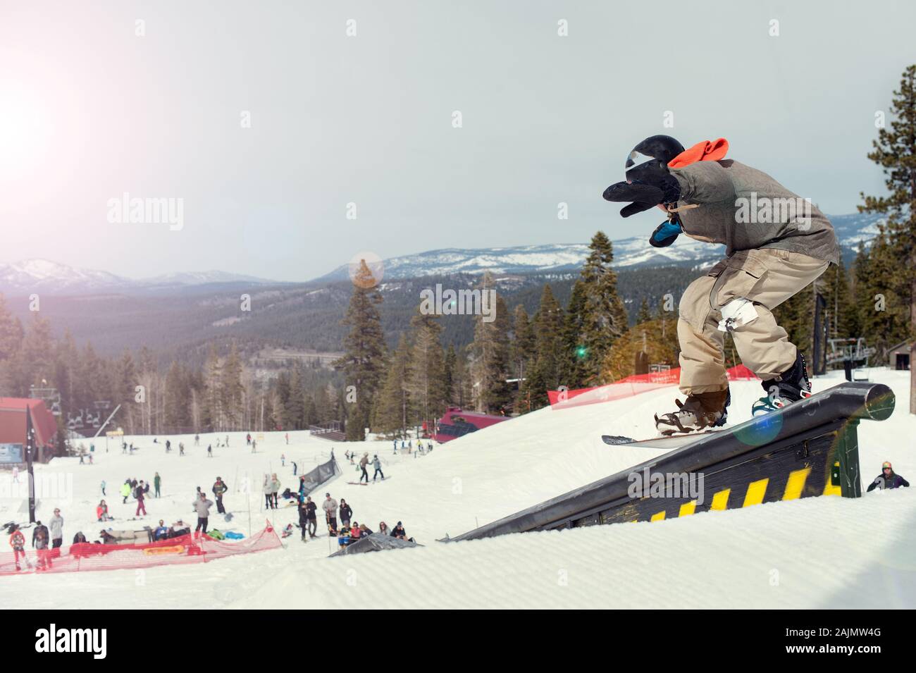 snowboarder on a rail in lake tahoe ca Stock Photo