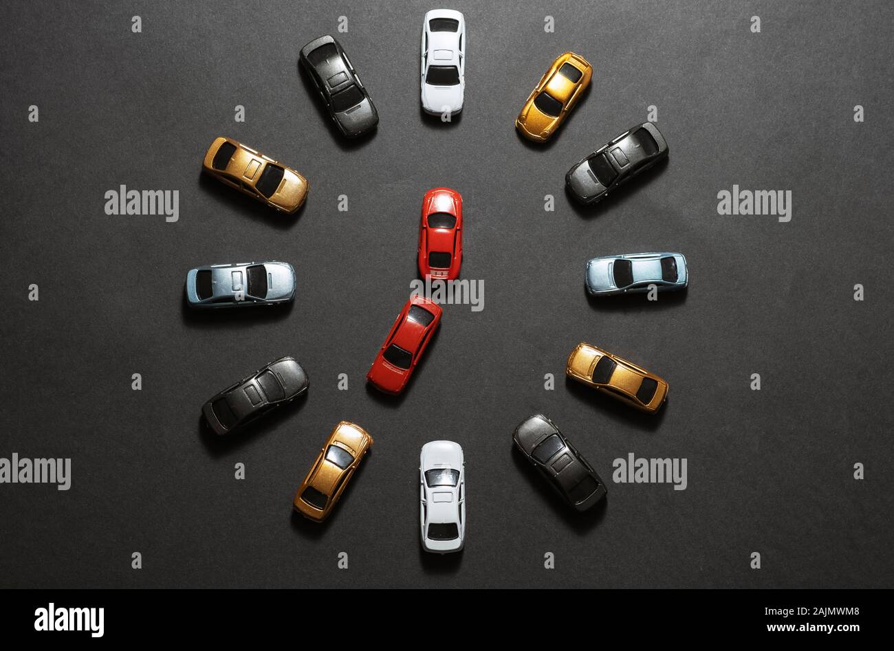 Parked toy cars on top view like a clock it looks like 7/12 Stock Photo