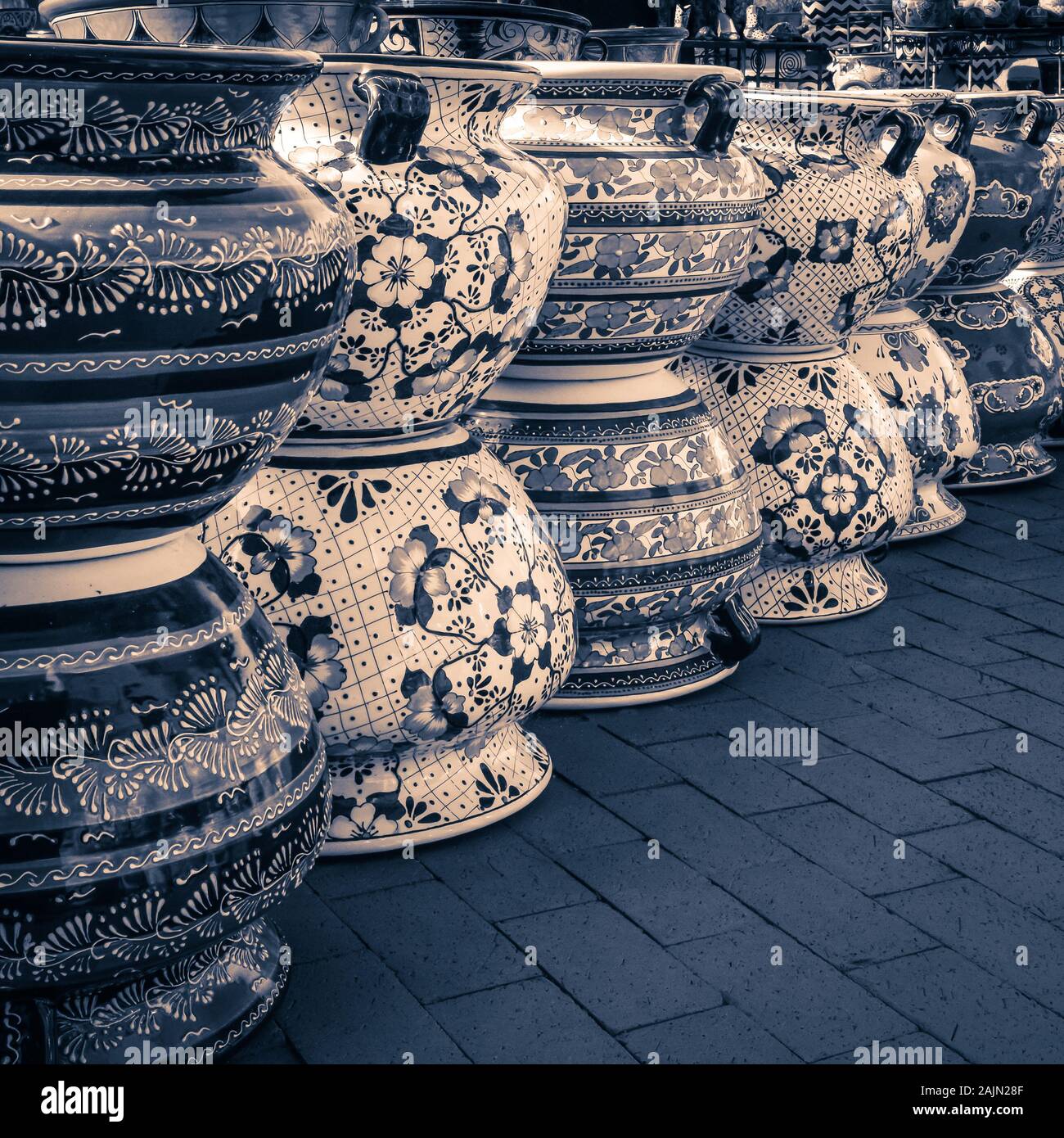 A close up of stacked decorative Mexican Pots in selenium tone in artisan town of Tubac, AZ Stock Photo