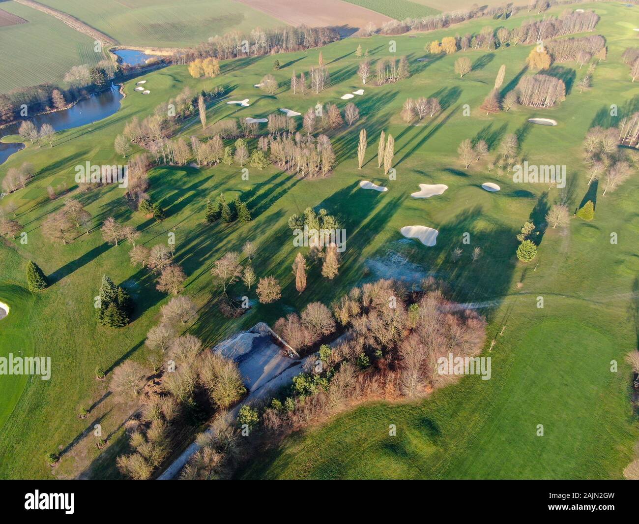 Aerial view of a golf course. Colorful trees and green course during autumn season in the South of Belgium, Walloon Brabant. Stock Photo