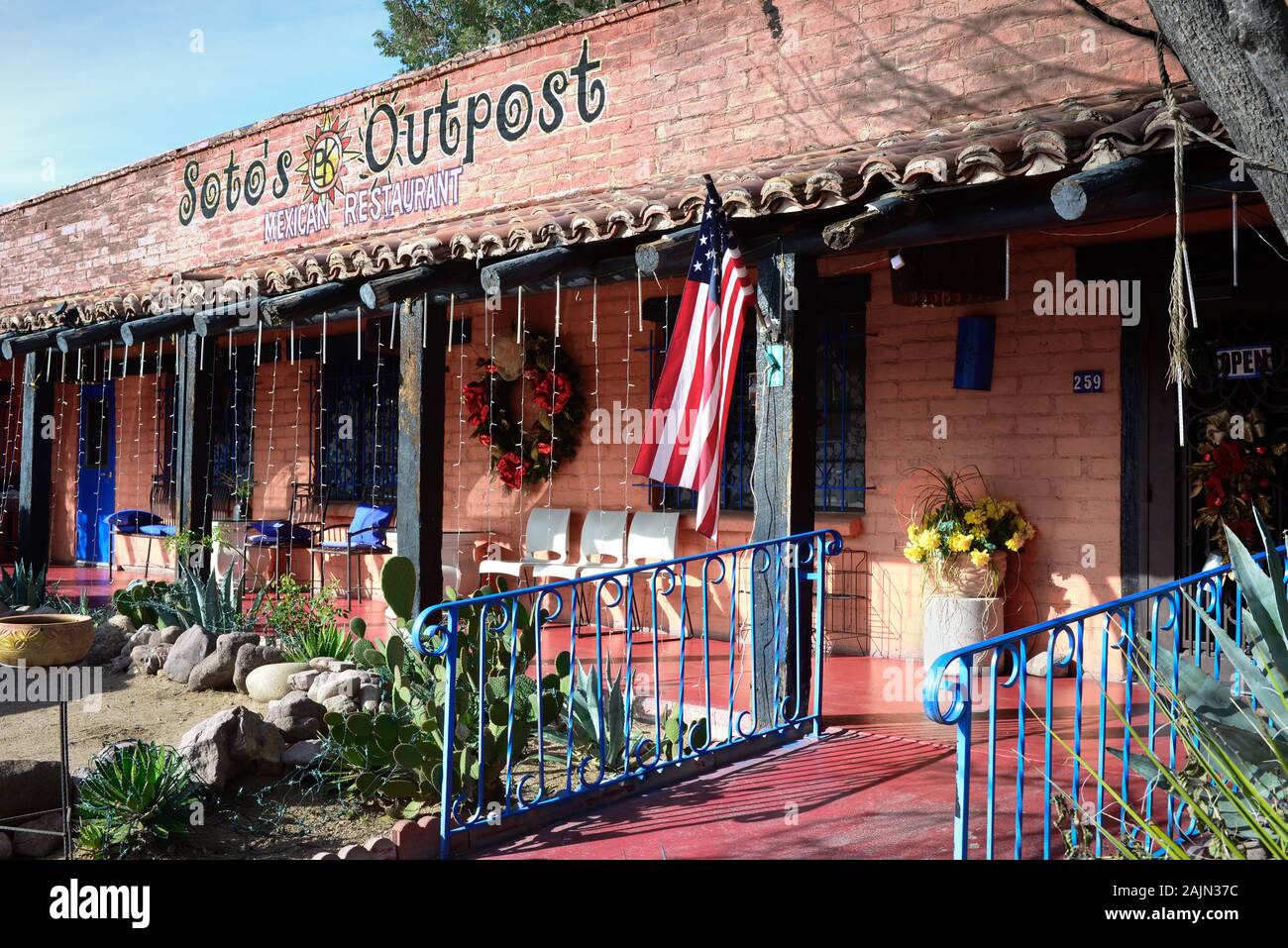 A charming old adobe building with porch and cacti garden houses Soto's Outpost Mexican Restaurant in the artisan town of Tubac, AZ, USA Stock Photo