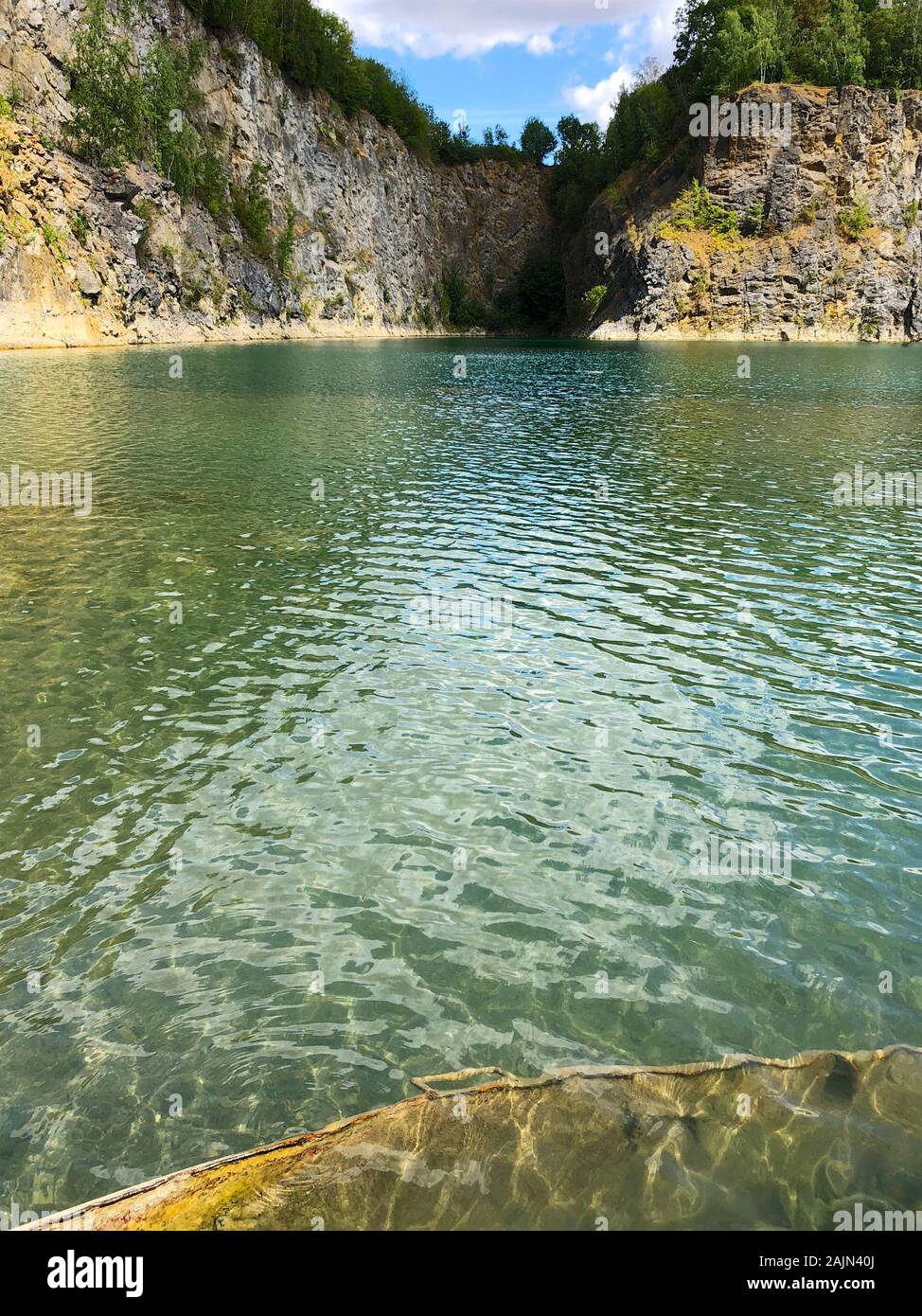 Flooded quarry and dive site. Famous location for fresh water divers and leisure attraction. Quarry now explored by scuba divers. Adrenaline hobby Stock Photo