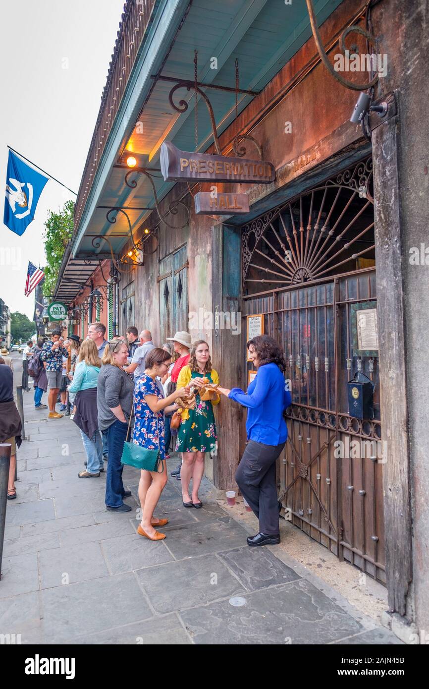 People waiting in line outside Preservation Hall jazz music venue, New Orleans, Louisiana, USA Stock Photo