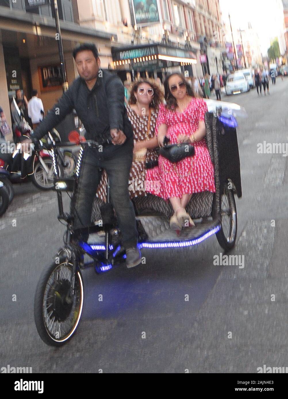 Myleene Klass ARIVES IN STYLE ON A RICKSHAW at the London Coliseum to Watch  the Gala Night of On Your Feet! the Story of Emilio and Gloria Estefan  Stock Photo - Alamy