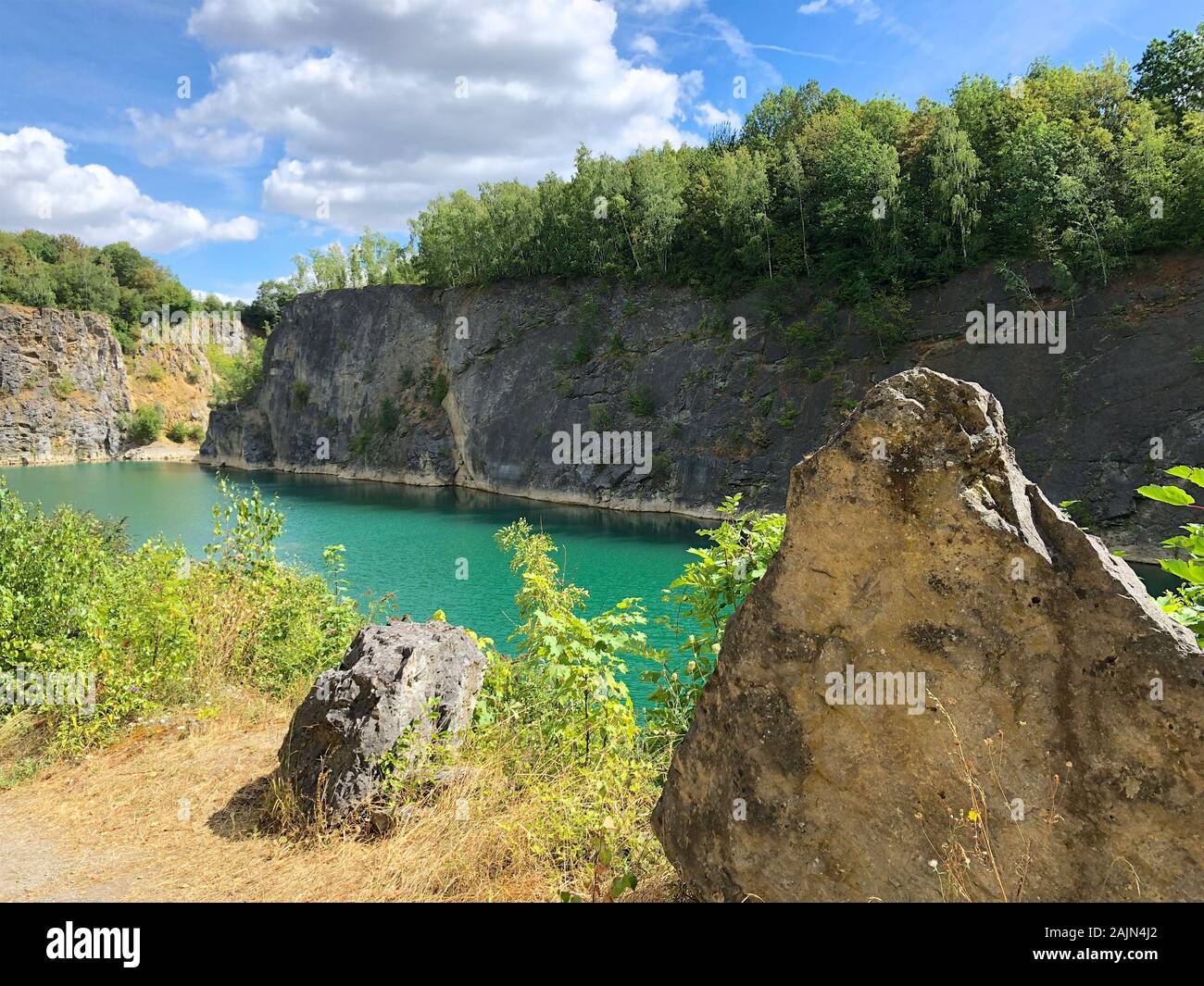 Fishing at deep quarry lake hires stock photography and images Alamy
