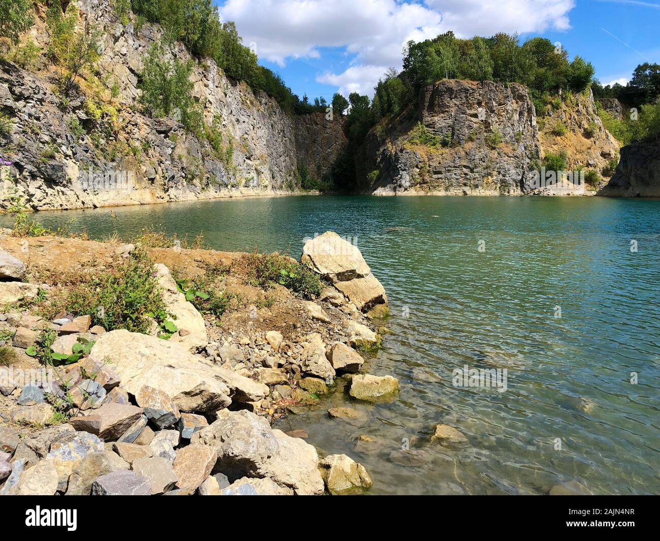 Fishing at deep quarry lake hires stock photography and images Alamy