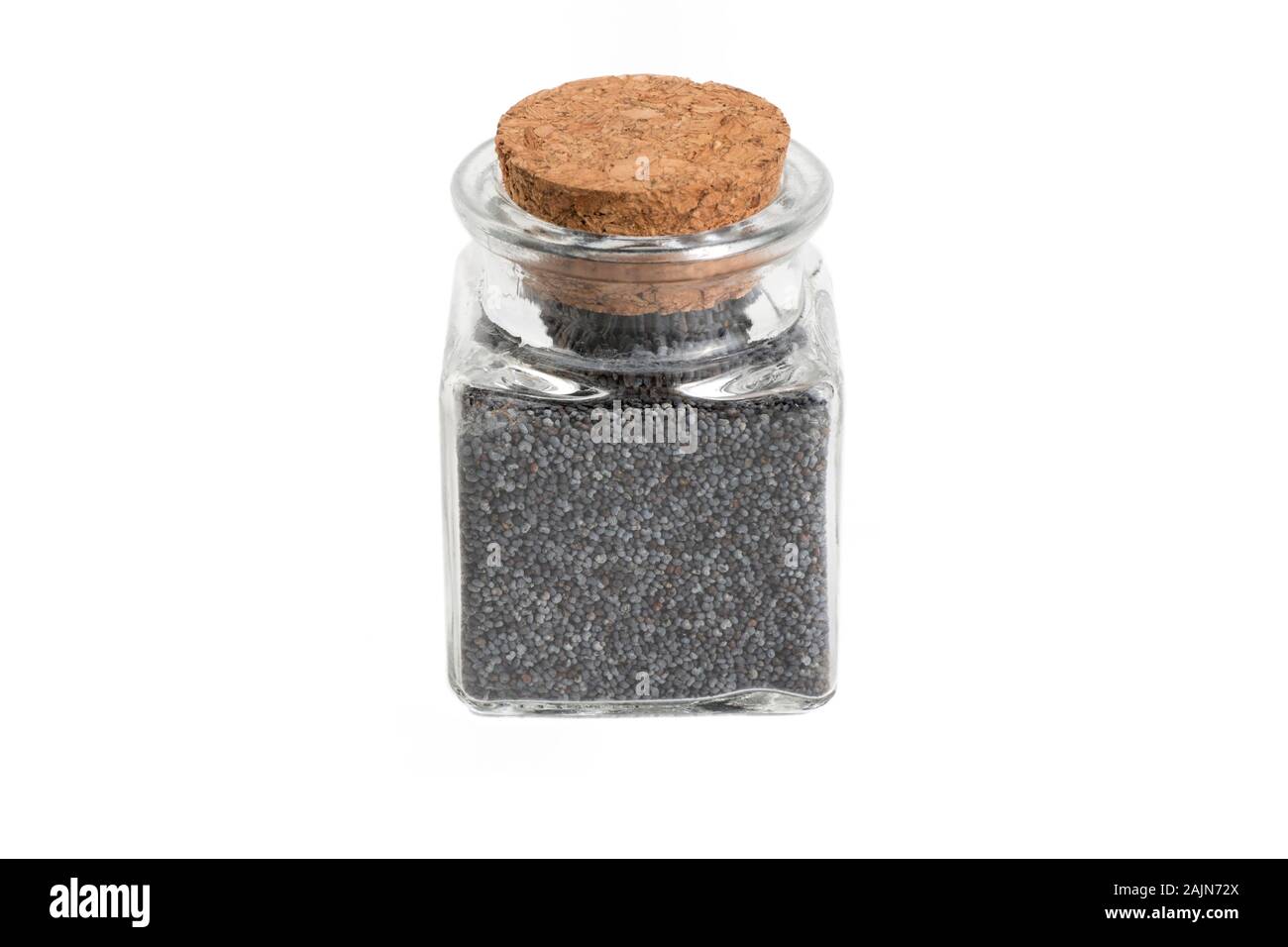 blue poppy seeds in a glass jar isolated on white background. food