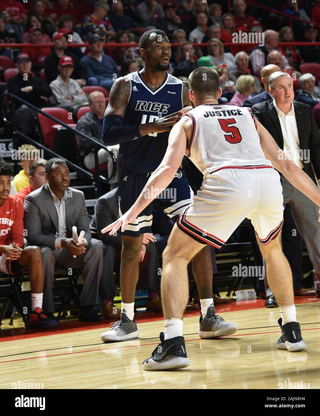 January 4, 2020: Rice Owls forward Robert Martin (10) looks over Western  Kentucky Hilltoppers guard Camron Justice (5) and the defense during a NCAA  basketball game between the Rice Owls and the