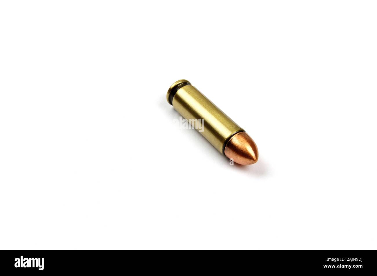 one single hand pistol bullet on a white background Stock Photo