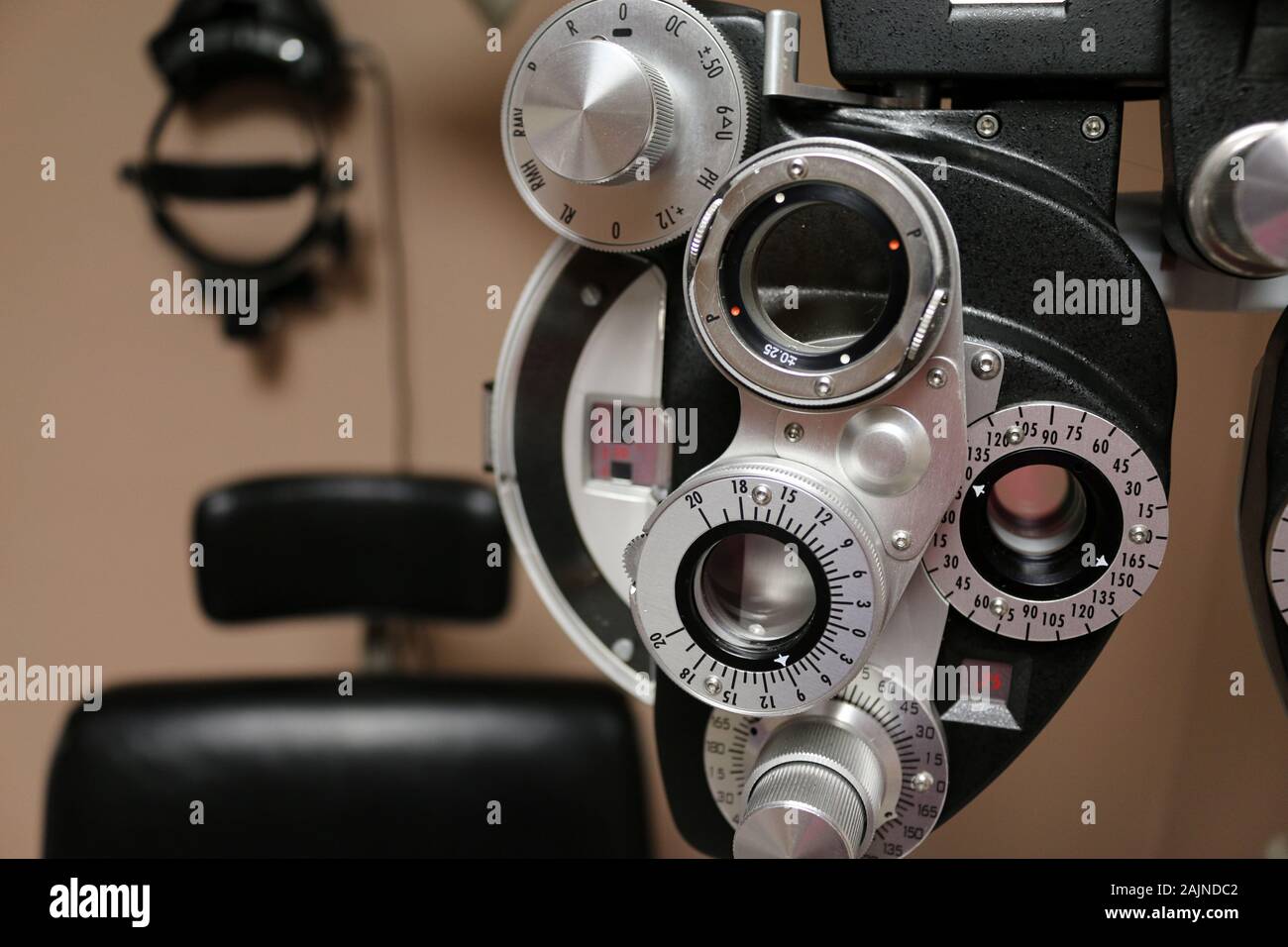 Close Up of Phoropter with Eye Exam chair and BIO Equipment in