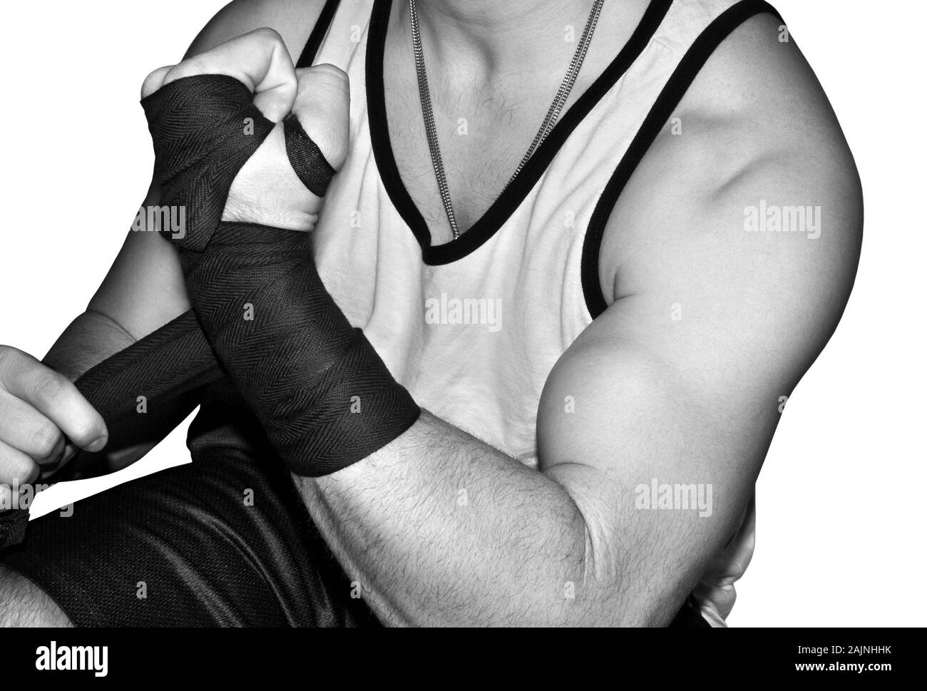 Young mixed martial arts male fighter wrapping his wrists Stock Photo