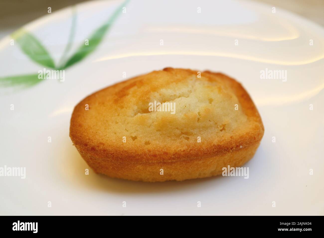 French Almond Petit-Four Cake Called Financier Served on White Plate Stock Photo