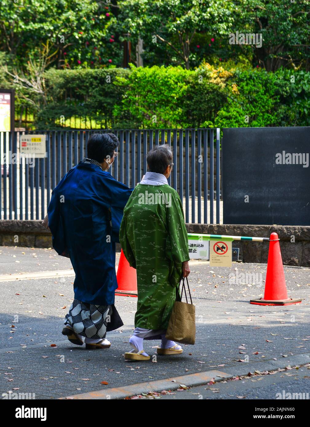 Tokyo, Japan - Apr 7, 2019. Old women in kimono dress walking on street ...