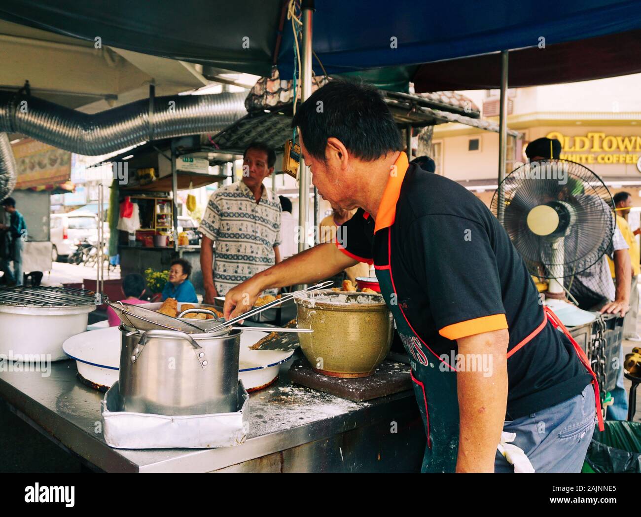 George Town, Malaysia - Aug 24, 2014. Street food restaurant kitchen in ...