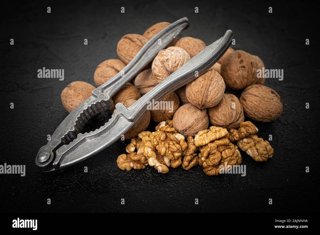 Walnut on over black slate stone background Stock Photo