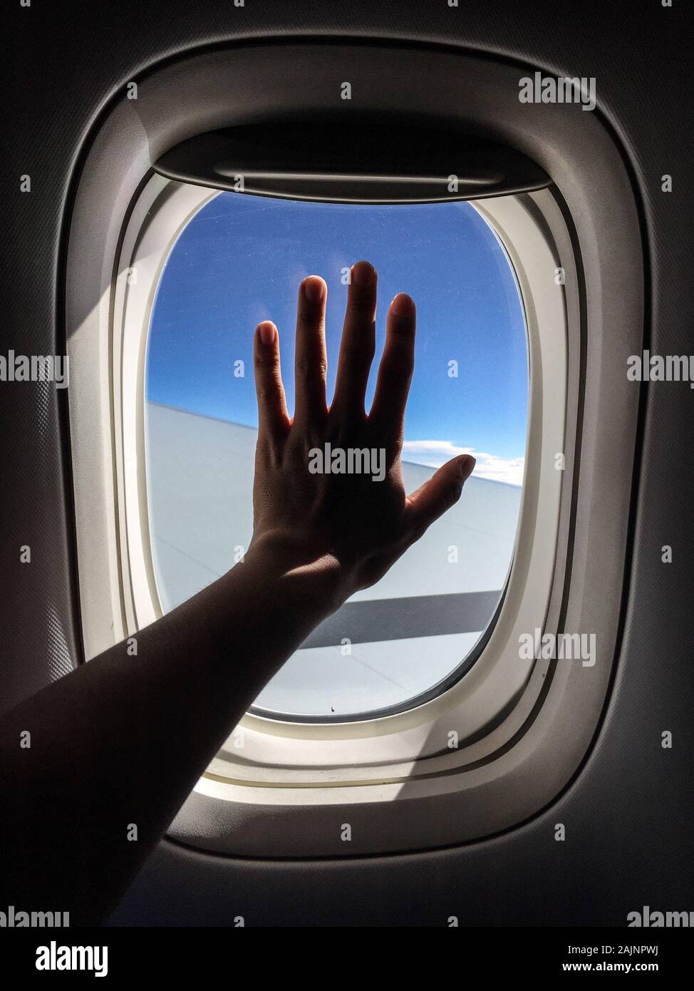 Hand Over Window A hand over the window of airplane. Travel concept Stock Photo - Alamy