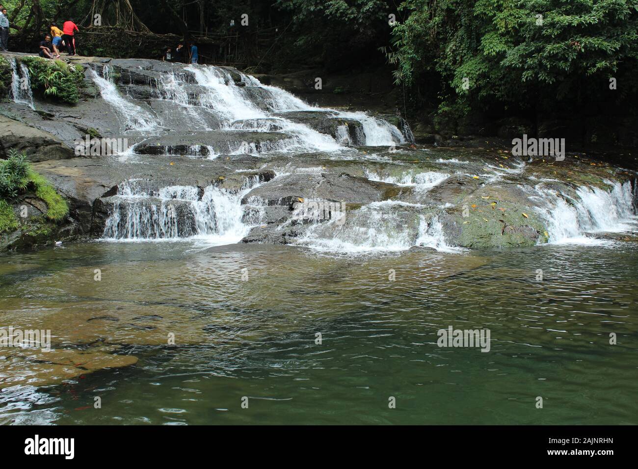 Slanted Fall Beauty of a slanting waterfalls in the forest Stock Photo - Alamy