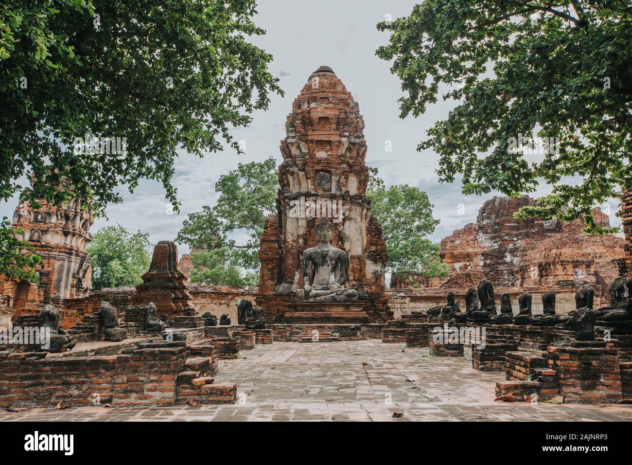 Amazing details of the Wat Maha That temple with the ruins of the Buddha statues. Stock Photo