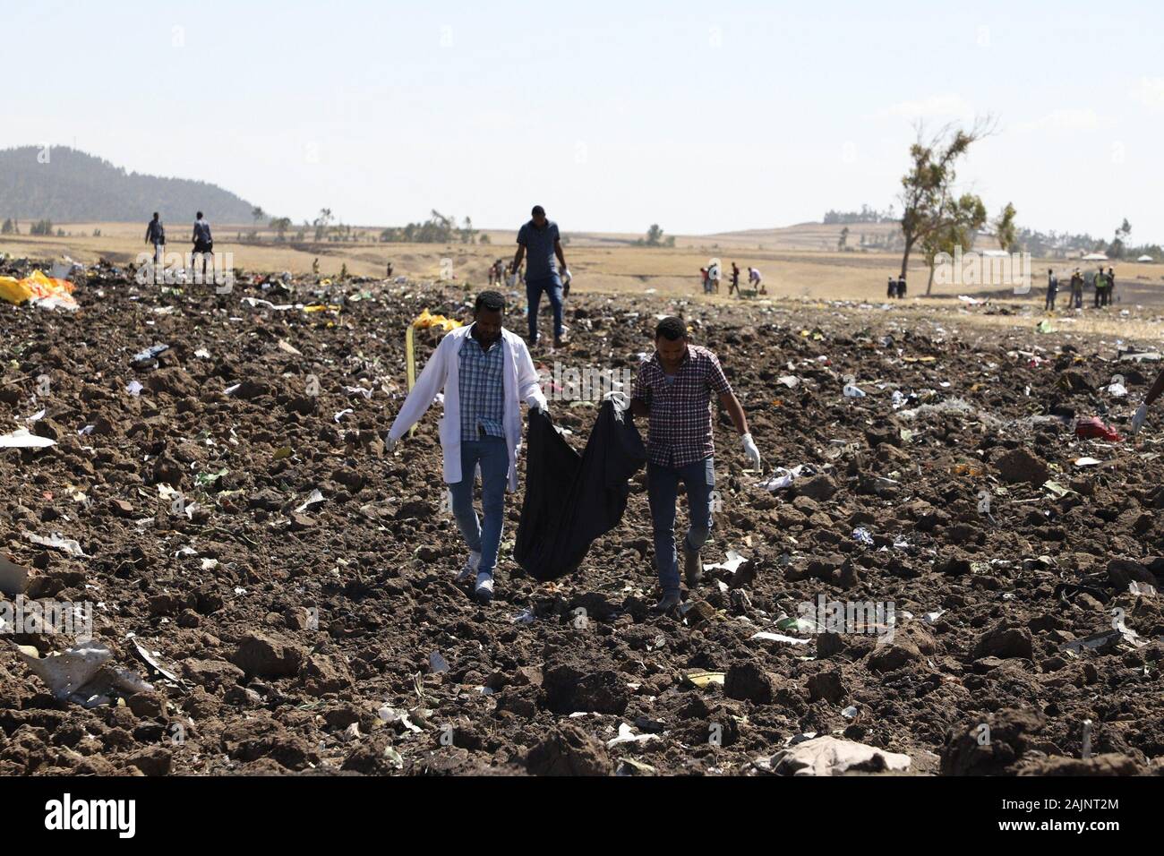 Beijing, Ethiopia. 10th Mar, 2019. Rescuers look for wreckage of an Ethiopian Airlines aircraft at the crash site near Bishoftu town, about 45 kilometers from the capital Addis Ababa, Ethiopia, March 10, 2019. The Nairobi-bound Boeing 737-8 MAX crashed on March 10, 2019 just minutes after takeoff from Addis Ababa Bole International Airport, killing all 157 people aboard. Earlier on March 11, 2019, Ethiopian Airlines announced its decision to suspend commercial operations of all Boeing 737-Max 8 aircraft. Credit: Michael Tewelde/Xinhua/Alamy Live News Stock Photo