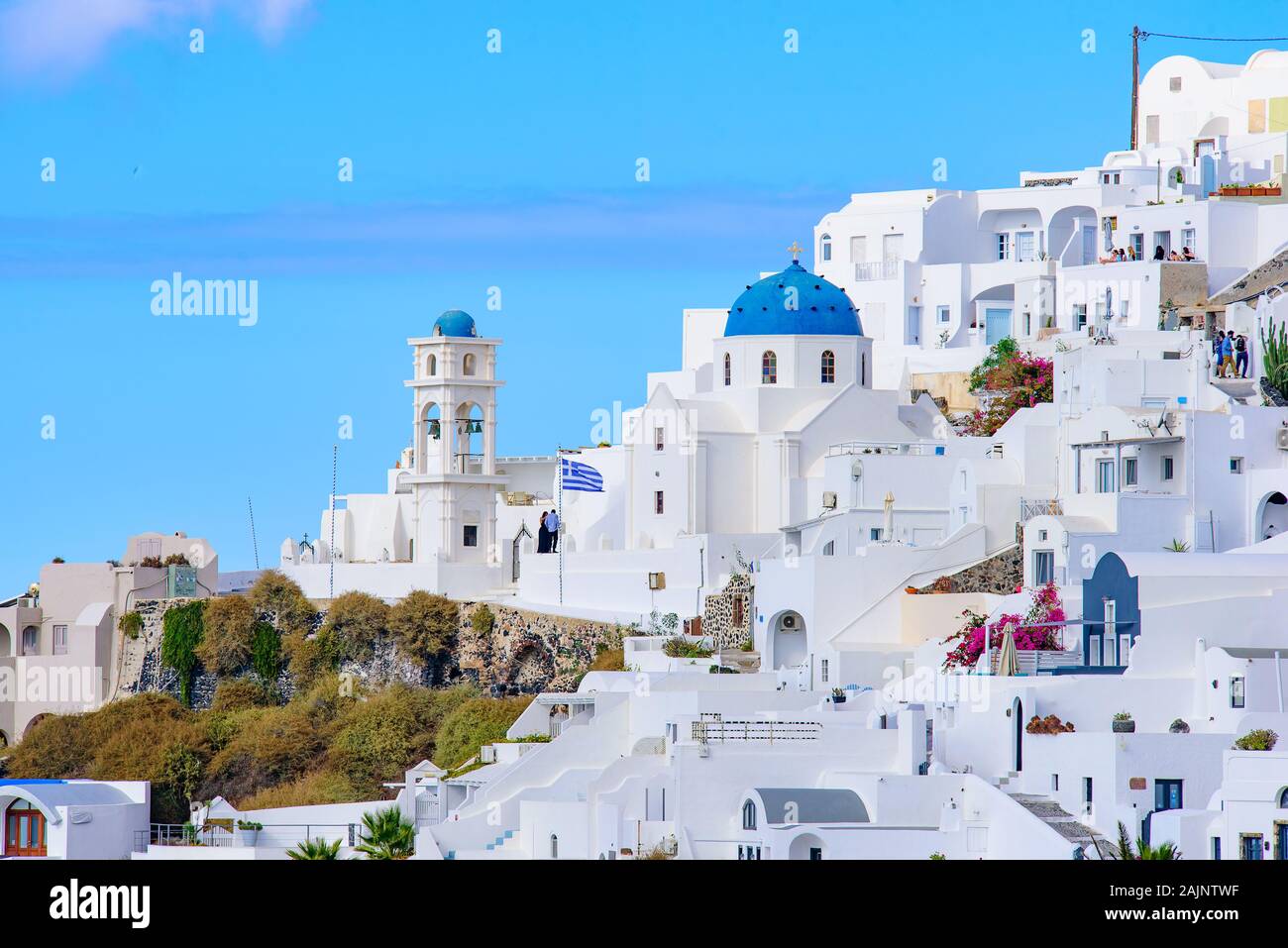 A blue domed church with bell tower in Imerovigli village, Santorini, Greece Stock Photo